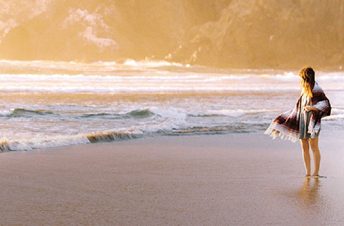 Woman walking on beach