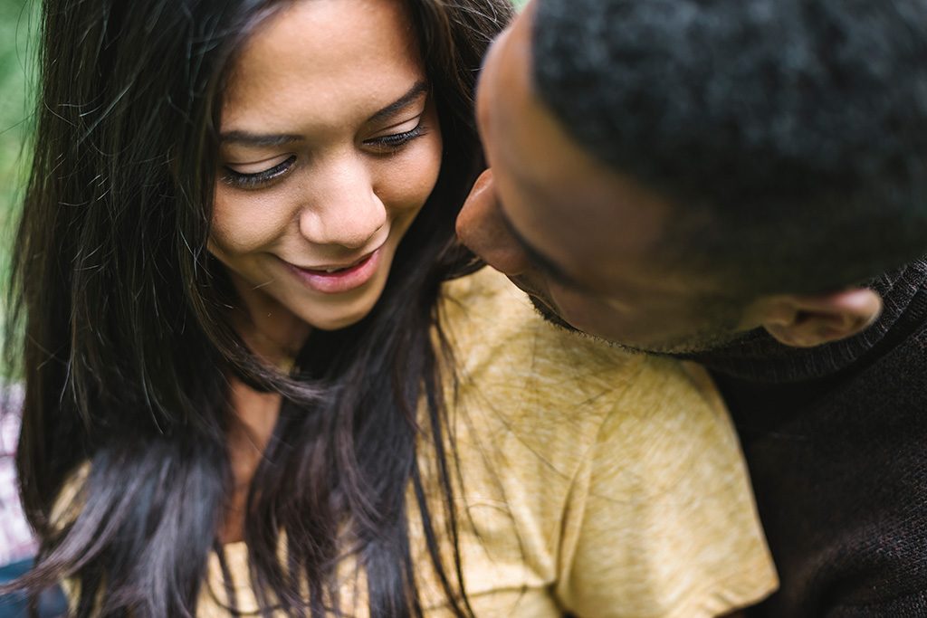 Young man and woman embracing