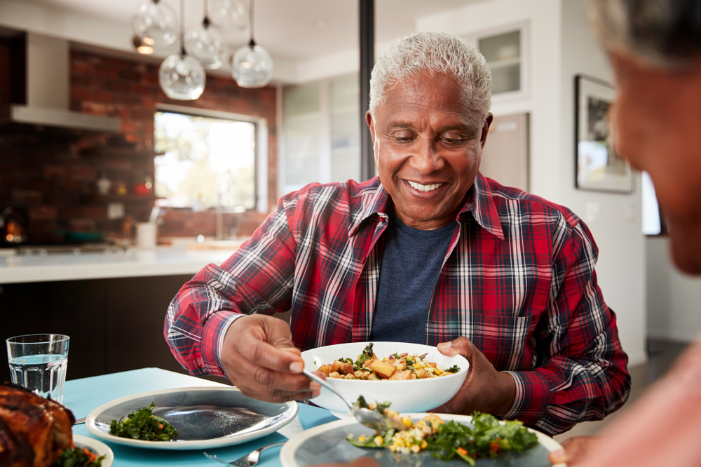 Seniors eating a healthy meal at home 