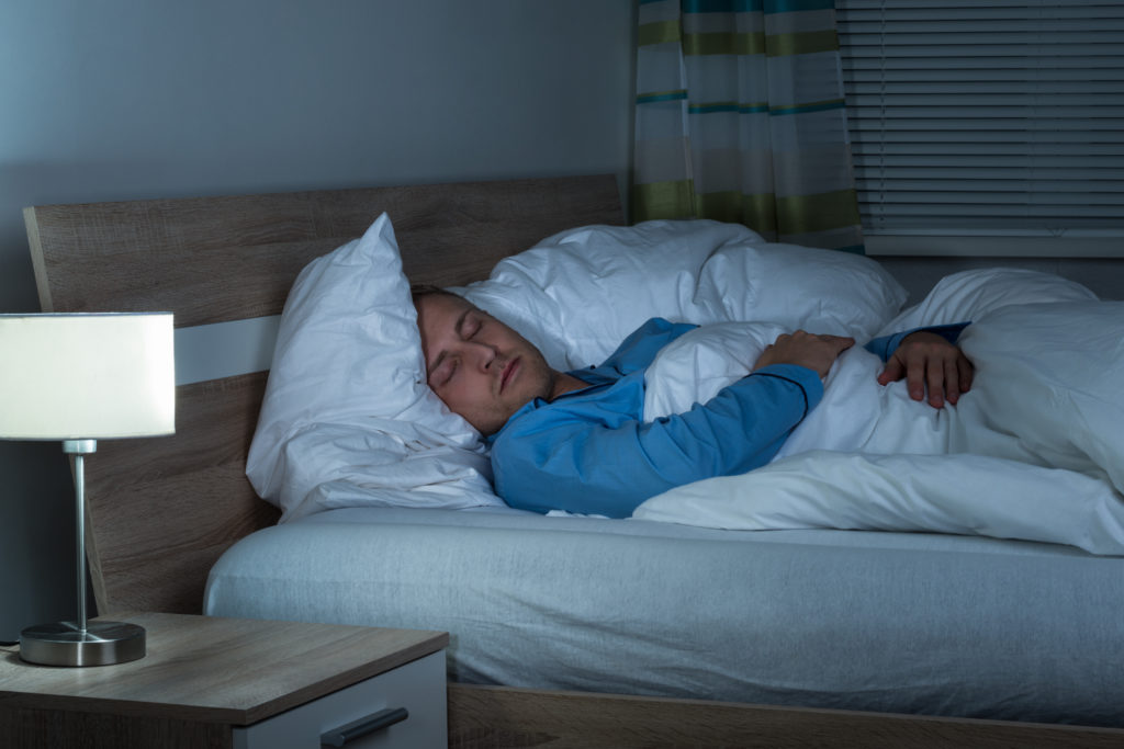 Man sleeping in bed