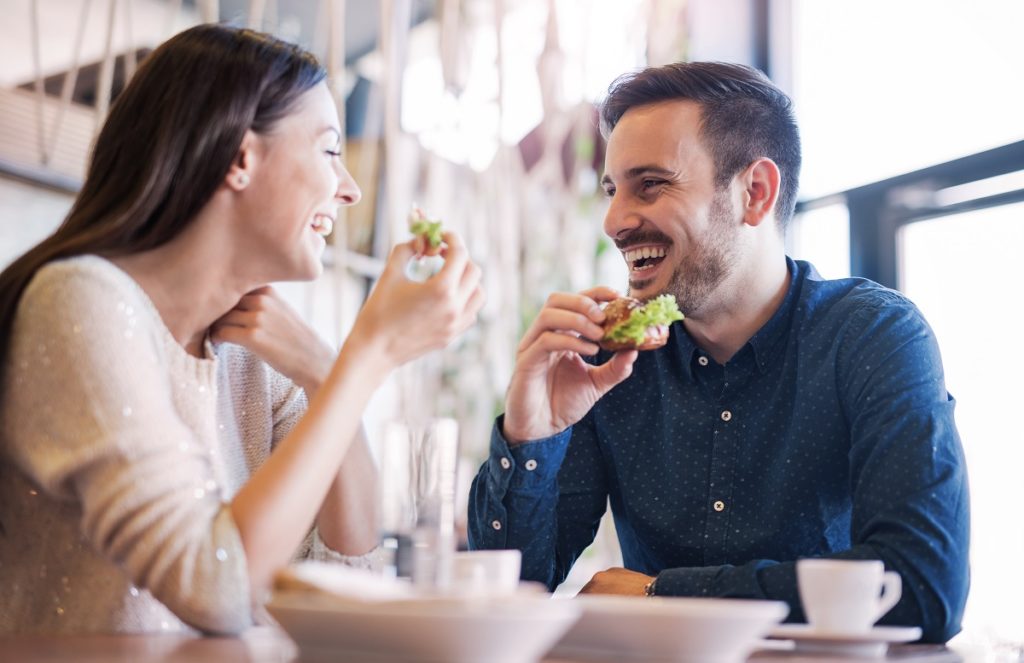 Couple eating in cafe