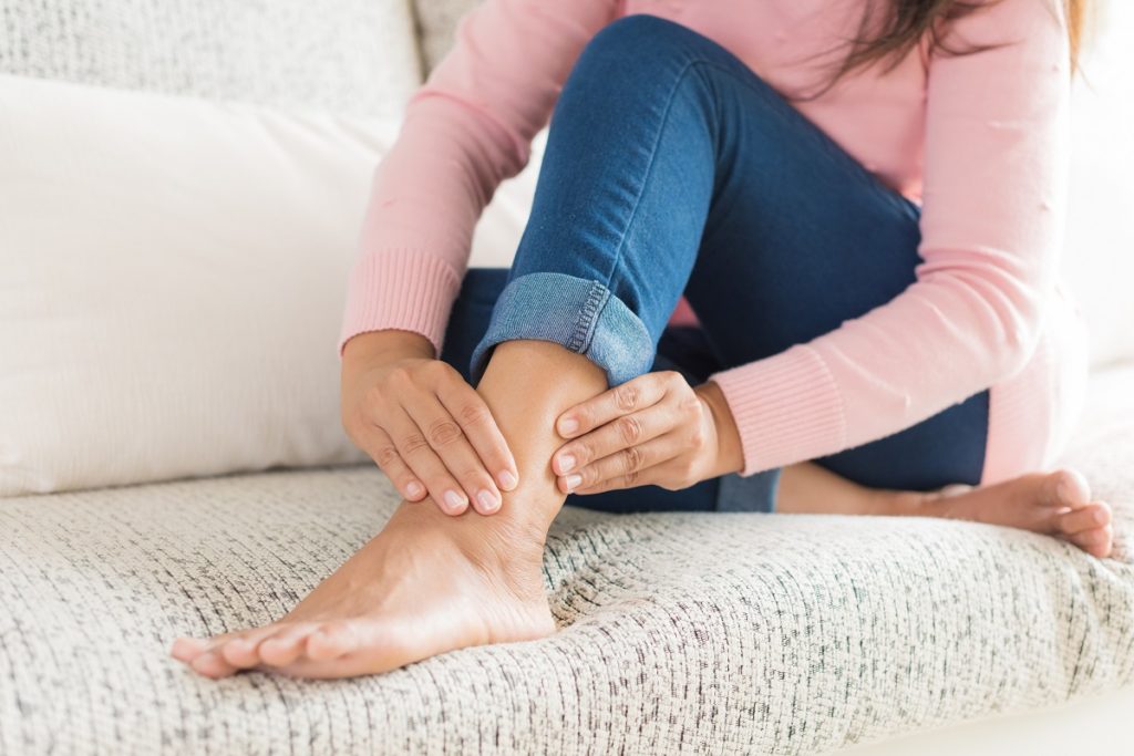 Woman with sore ankle