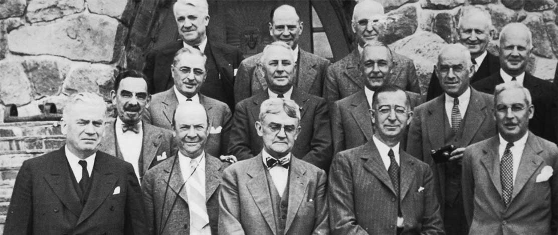 Black and white group photo of The Portland Clinic founders and their peers.