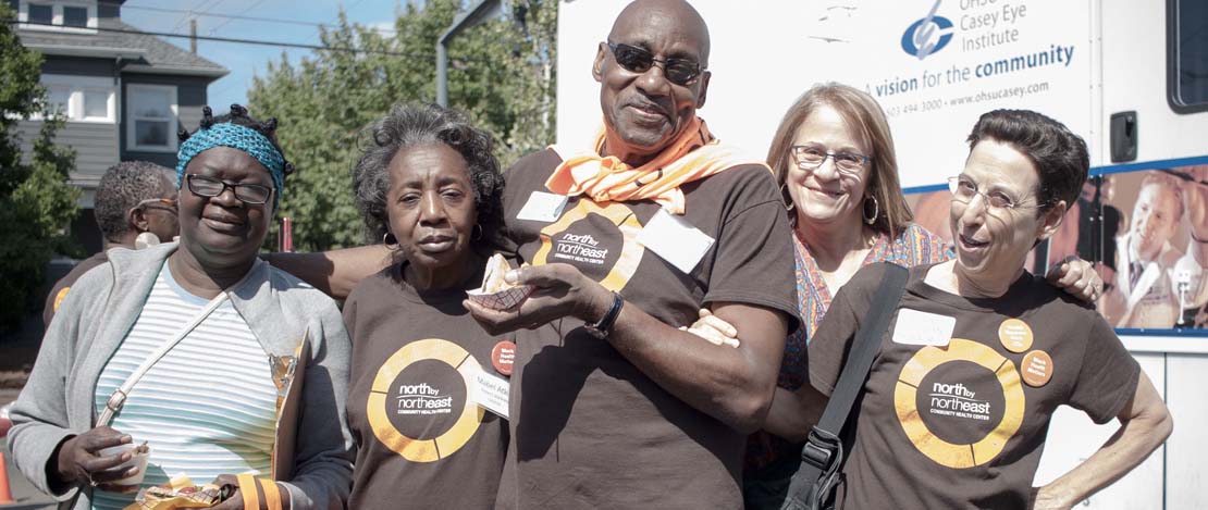 Group photo of Portland Clinic Foundation staff members and volunteers at a community event.