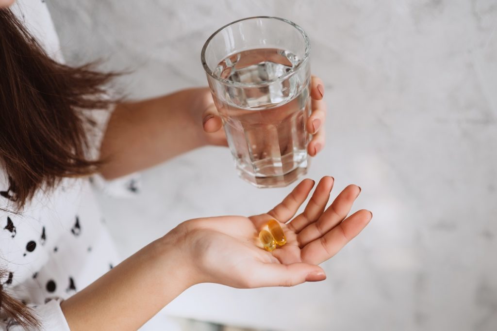 Woman taking vitamins