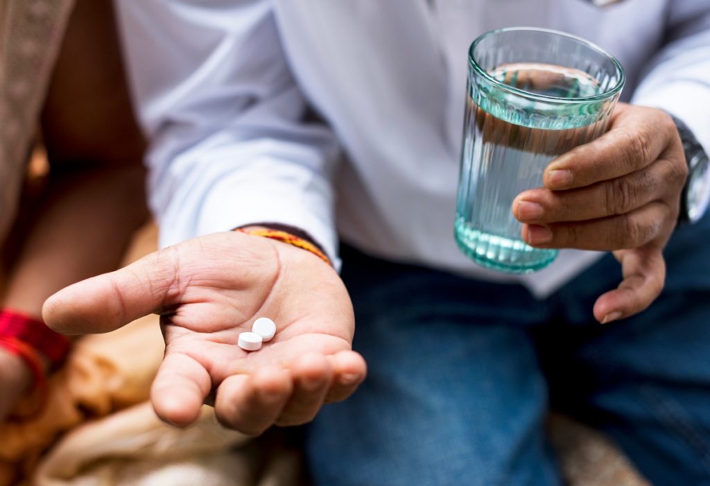 Man taking medicine