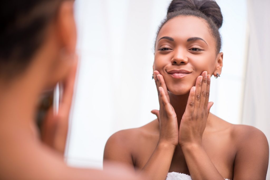 Woman admiring her complexion