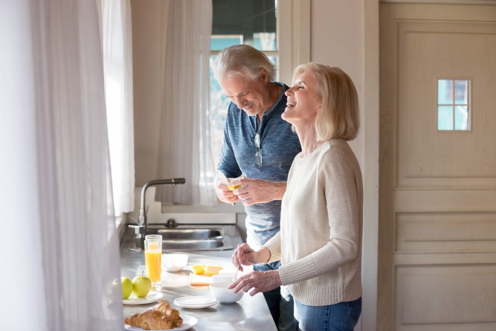 Senior couple preparing breakfast