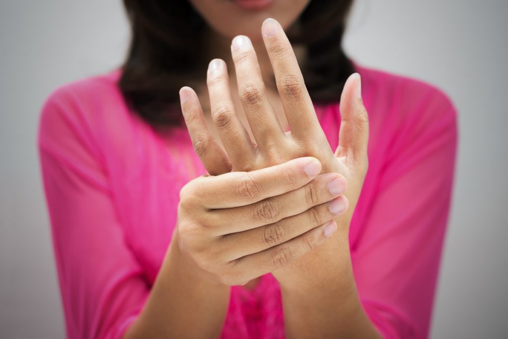 Woman with hand pain