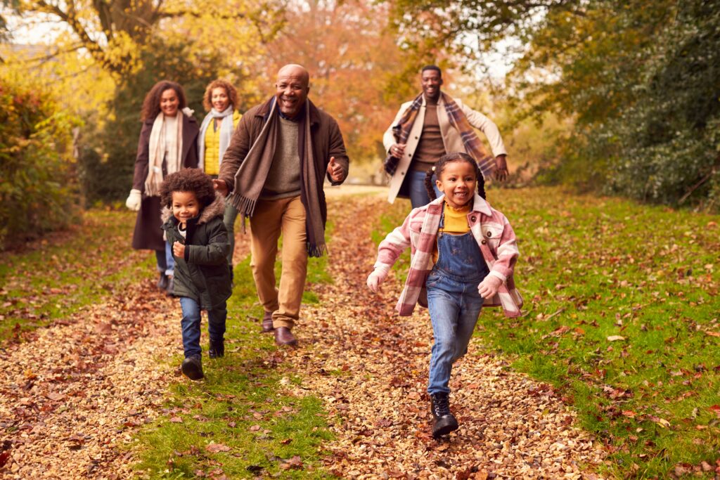 Family hiking in the forest in autumn